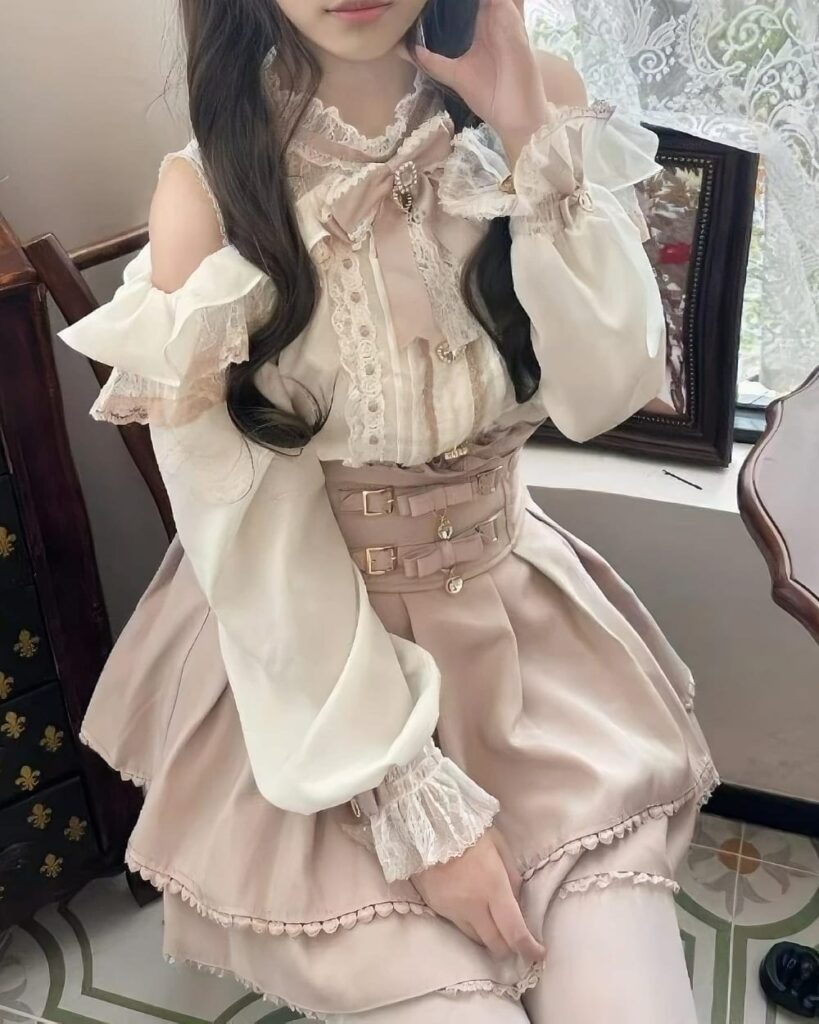 Jirai Kei Set: Beige ruffled skirt and off-shoulder blouse with lace details and a corset belt.