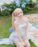 Model wearing a Water Melody Lolita Inspired Swimwear, featuring a light blue and white lace design.
