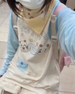 Kawaii Panda Pastel Long Sleeve T-Shirt showing a cute panda design with flowers and stars.