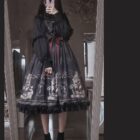 A person wearing a black Gothic Lolita Dress - Dolly Kei with lace trim and a detailed pattern.