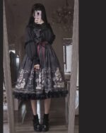 A person wearing a black Gothic Lolita Dress - Dolly Kei with lace trim and a detailed pattern.