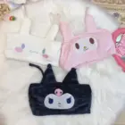 Sanrio-inspired pajamas featuring My Melody, Kuromi, and Chococat in plush pouches.