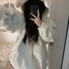 Person wearing a white Fluffy Bear Paw Hoodie with a hood and zipper.