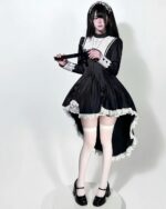 Black Nun Dress - Gothic Aesthetic, detailed with lace and a high slit; a dark and dramatic costume.