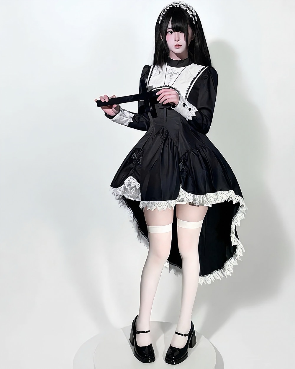 Black Nun Dress - Gothic Aesthetic, detailed with lace and a high slit; a dark and dramatic costume.
