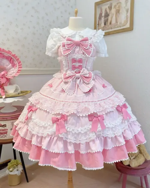 Pink Hime Lolita Dress featuring layered ruffles, ribbons, and bows. A detailed Lolita aesthetic garment.
