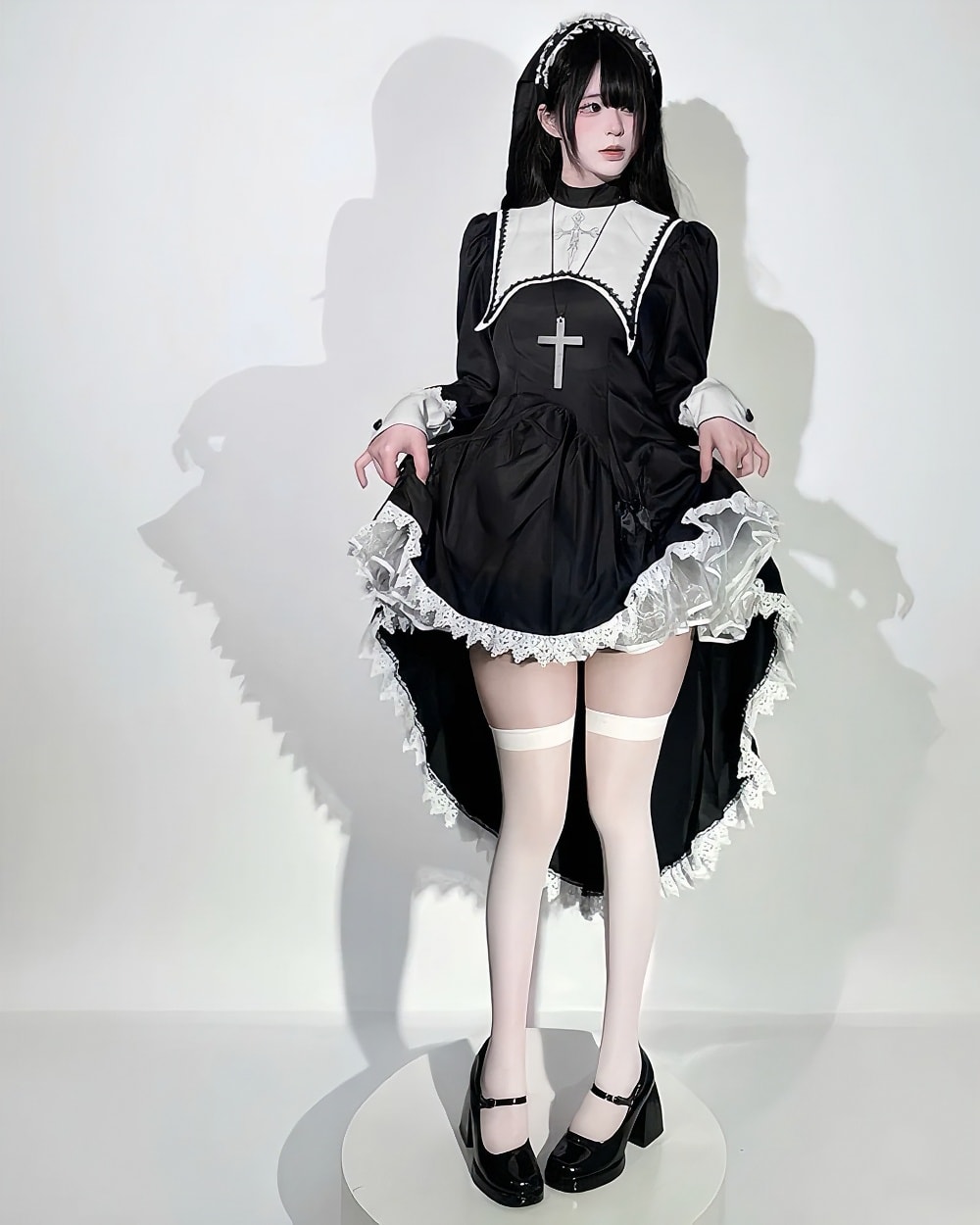 Black Nun Dress - Gothic Aesthetic, featuring a black dress with white lace trim and cross detail.