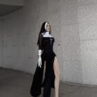 Black Anime Nun Costume Halloween Edition featuring a hooded robe, gloves, and crucifix.