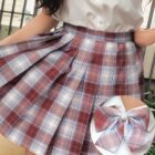 Close-up of a JK Plaid Skirt featuring a red and white plaid pattern and a bow accessory.