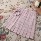 Pink JK Plaid Skirt with bow, pleated design on floral background.