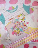 Mezzo Piano Print Top featuring cartoon characters and stars, Jojifuku aesthetic.