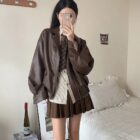 Woman posing with a brown Korean Style Jacket, preppy aesthetic, layered outfit.