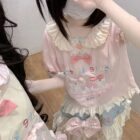 Lolita Skirt Top Set featuring a pink and white print with cartoon characters.