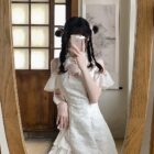 White Qi Lolita Dress with lace and ruffled details, featuring off-the-shoulder sleeves.