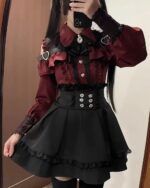 Red and black Jirai Kei Dress Collection featuring a ruffled blouse and gathered skirt with a corset belt.