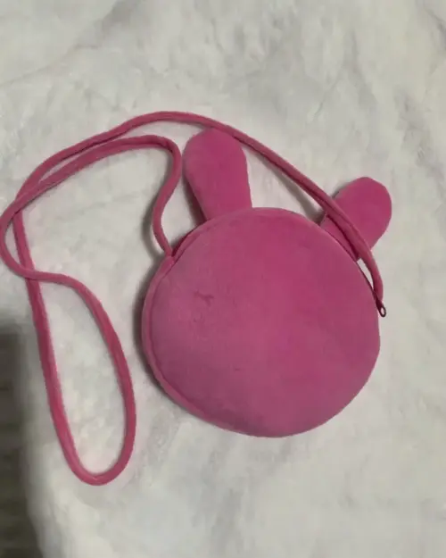 Pink Mezzo Piano Cross Body Bag, featuring plush ears and a crossbody strap.