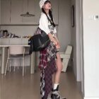 Patched plaid Grunge Aesthetic Skirt with a layered, distressed look.