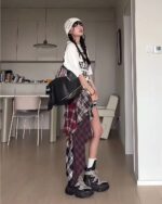 Patched plaid Grunge Aesthetic Skirt with a layered, distressed look.