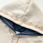 Close-up of a Loose Thickened Pullover Hoodie - Ethno-Chic Hoodie featuring embroidered arrow designs.