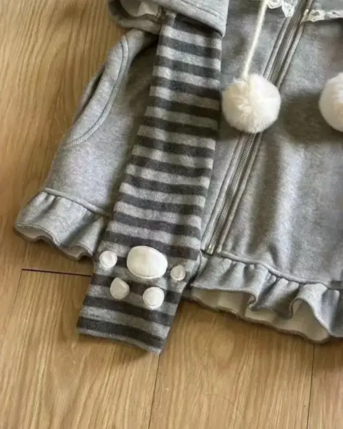 Gray Striped Sleeves Neko Hoodie with paw accents and pom-poms.