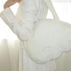 Close-up of a white Angel Wings Bag, Harajuku aesthetic.