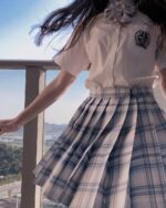 JK Plaid Skirt Collection - a pleated plaid skirt with a white blouse.