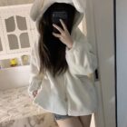 White Fluffy Bear Paw Hoodie worn by a person, featuring a hood and earmuffs.