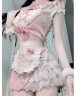 Close-up of a pink maid dress with lace details and ruffles. This Pink Maid Dress showcases a Dollette Aesthetic style.