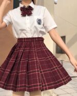 A burgundy JK Plaid Skirt, pleated design, part of the Summer Plaid Skirt Collection.
