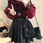 Woman wearing a Long Sleeve Blouse – Jirai Kei Aesthetic, featuring ruffles and lace details, styled with a striped skirt and accessories.