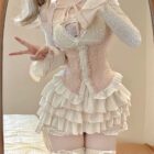Ruffled pink Dollette Aesthetic Dress set with corset and layered skirt. Lace details and long sleeves.