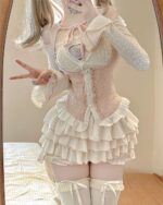 Ruffled pink Dollette Aesthetic Dress set with corset and layered skirt. Lace details and long sleeves.