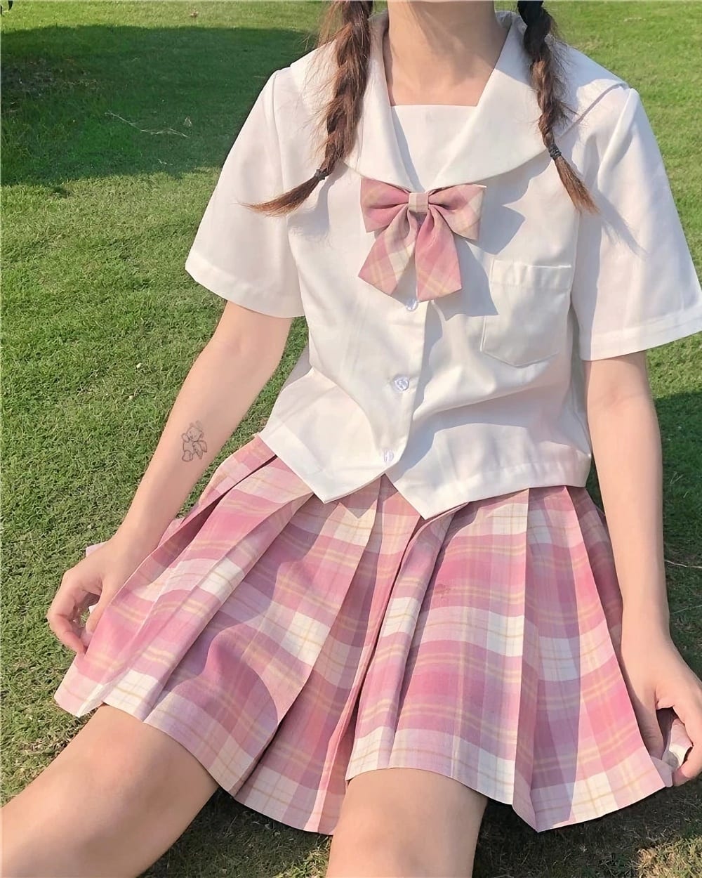 JK Plaid Skirt with a white sailor top and pink plaid skirt.