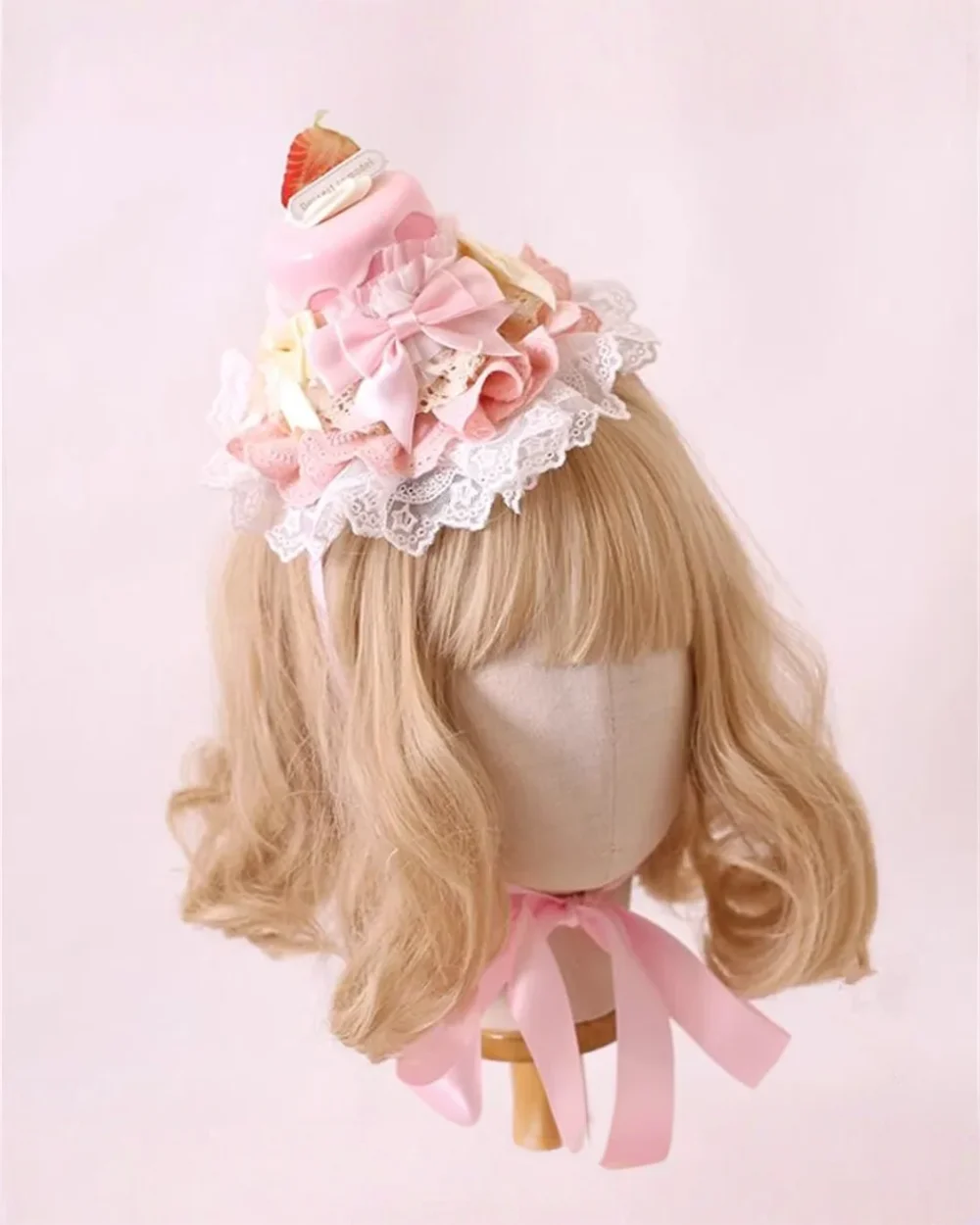 Sweet Lolita Hairpin with cake design, lace, and flowers on a mannequin head.