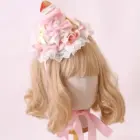 Sweet Lolita Hairpin displayed on a mannequin head, featuring ruffles and floral accents.