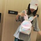 Pink Rabbit Ears Plush Backpack being held, featuring a zipper closure and shoulder straps.