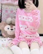 Mezzo Piano Shirt featuring a pink aesthetic with strawberries and hearts, worn by a person.