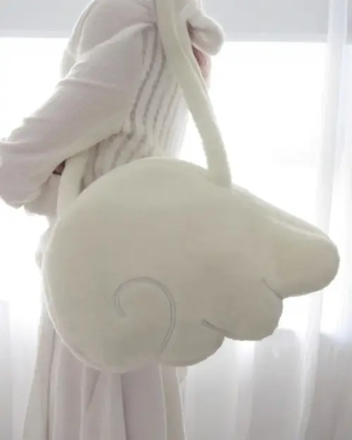 Close-up of a white Fluffy Angel Wings Bag, Harajuku aesthetic.
