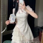 Cream Qi Lolita Dress with ruffled tiers and decorative embroidery.