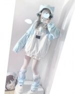 Long Sleeve Hoodie - Kawaii Gamer Hoodie, a light blue hooded sweatshirt with a cute, pastel aesthetic outfit.