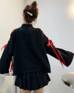 Black Kitsune Bowed Sweatshirt with red ribbon sleeves and a pleated skirt.