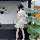 A person wearing a Qi Lolita Dress, a cheongsam-style cute dress with ruffled details and off-the-shoulder sleeves.