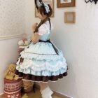 A light blue Frilly Ribbon Dress - Hime Lolita Dress, featuring layered ruffles and a brown underskirt.