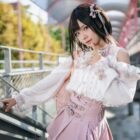 Model wearing a Jirai Kei Set: Japanese ruffled skirt and off-shoulder blouse with lace details.