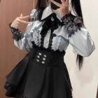 Jirai Kei Dress Collection: White and black lace-up dress with ruffled details and a corset.