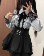 Jirai Kei Dress Collection: White and black lace-up dress with ruffled details and a corset.