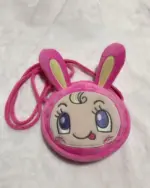 Close-up of a pink Mezzo Piano Cross Body Bag featuring a rabbit-shaped design and decorative details.