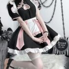 Detailed view of a black and white Kawaii Maid Dress cosplay outfit with lace and pink accents.