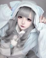 Model wearing a light blue Kawaii Gamer Hoodie. Cute, comfortable apparel.