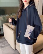 Close-up of a dark blue Ethno-Chic Hoodie, showcasing its thickened design and relaxed fit.